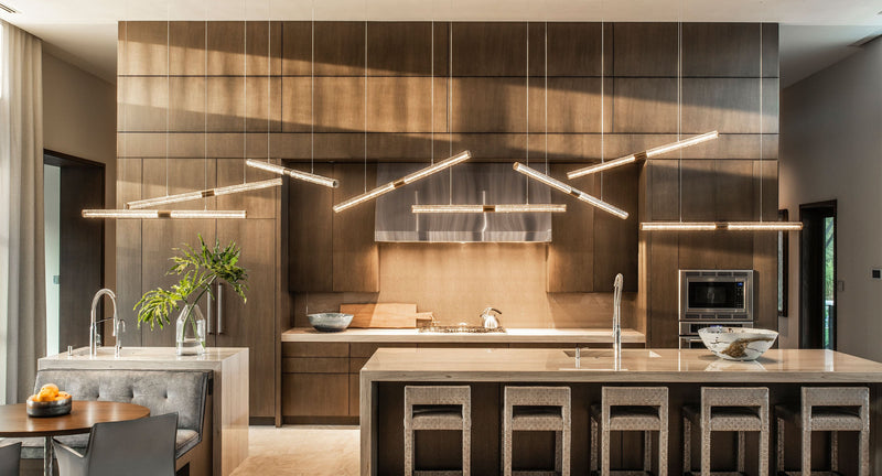 Fused glass Plice chandelier on a floating canopy above a Boca Raton dining room