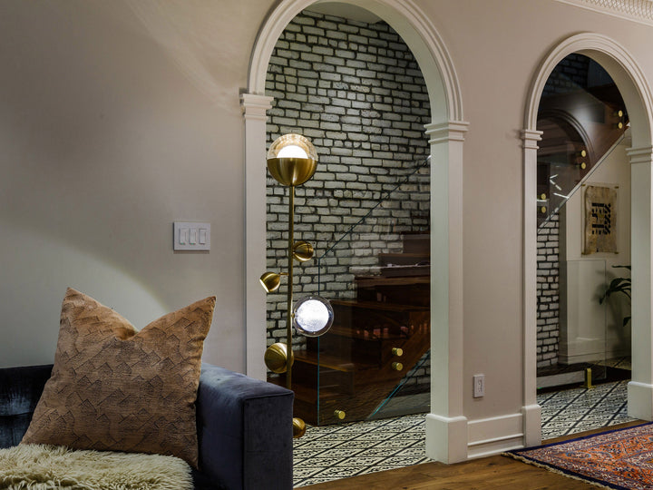 Bloom floor lamp in brass and hand-blown glass by Shakúff in a modern living room